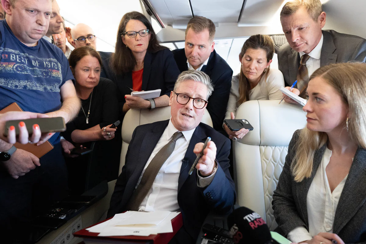 Prime Minister Sir Keir Starmer talks to journalists as he travels onboard a plane to Washington to attend a NATO summit on July 9, 2024. (Stefan Rousseau/PA Wire)