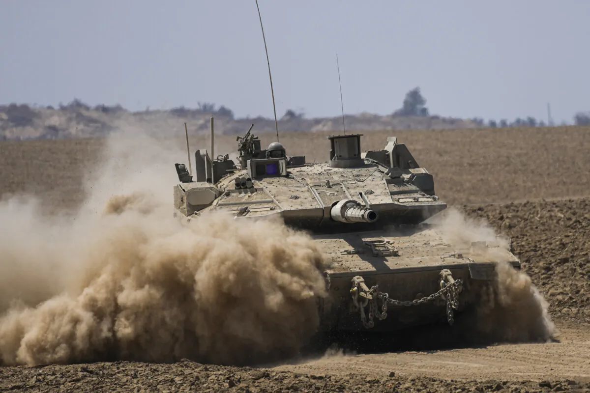 Israeli soldiers drive a tank near the Israeli-Gaza border, in southern Israell, on June 5, 2024. (The Canadian Press/AP-Tsafrir Abayov)