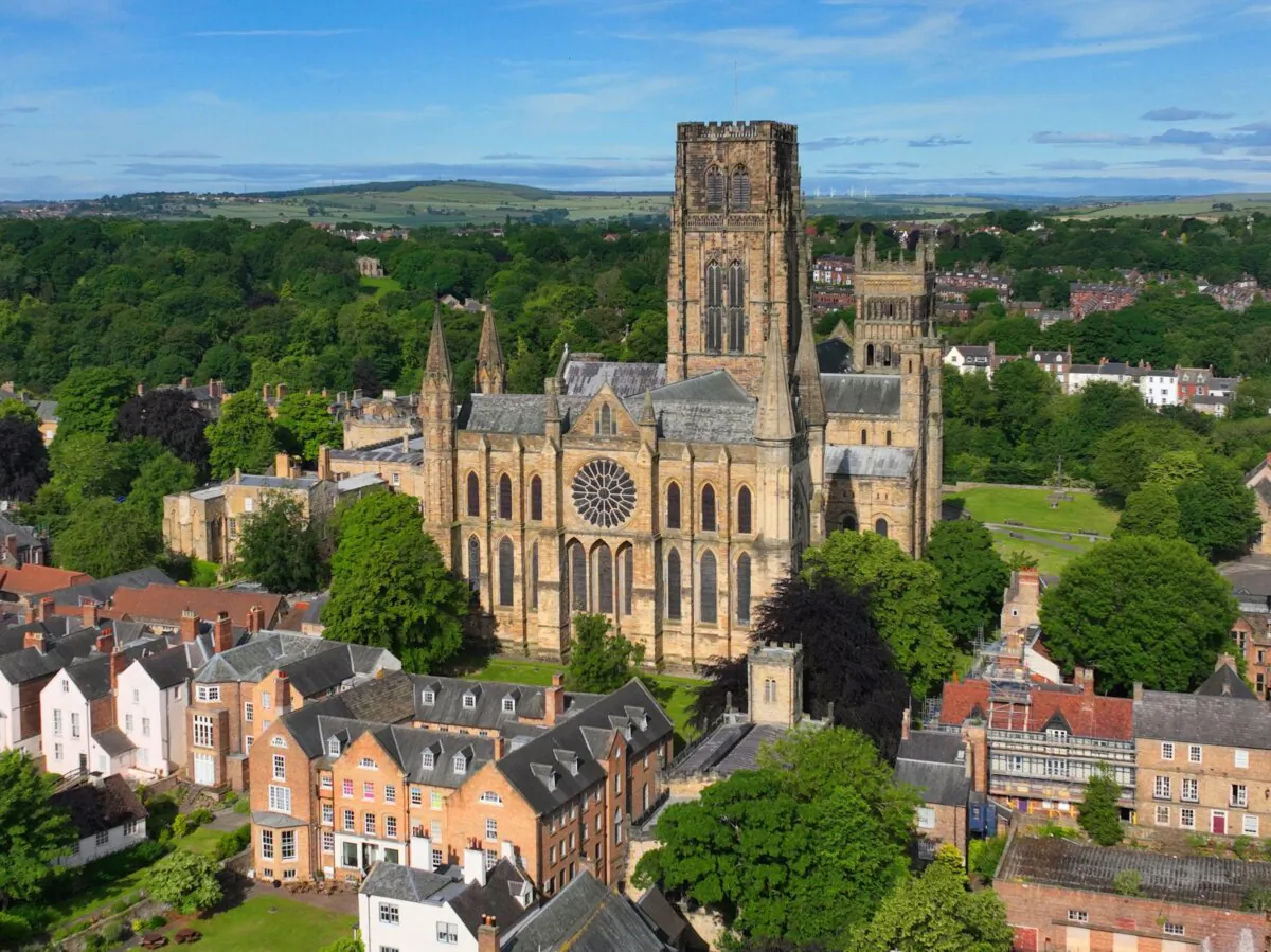 Built in 1093 as a shrine to the relics of St. Cuthbert and his biographer the Venerable Bede, Durham Cathedral is located in the county of Durham. The church is surrounded by lush greenery and nestled among town buildings. (Wangkun Jia/Shutterstock)