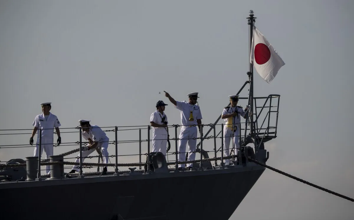 Sailors work on board the JS Amagiri (DD-154), an Asagiri-class destroyer in the Japan Maritime Self-Defense Force, as it arrives at port in Manila, Philippines, on Feb. 2, 2018. (Noel Celis/AFP via Getty Images)