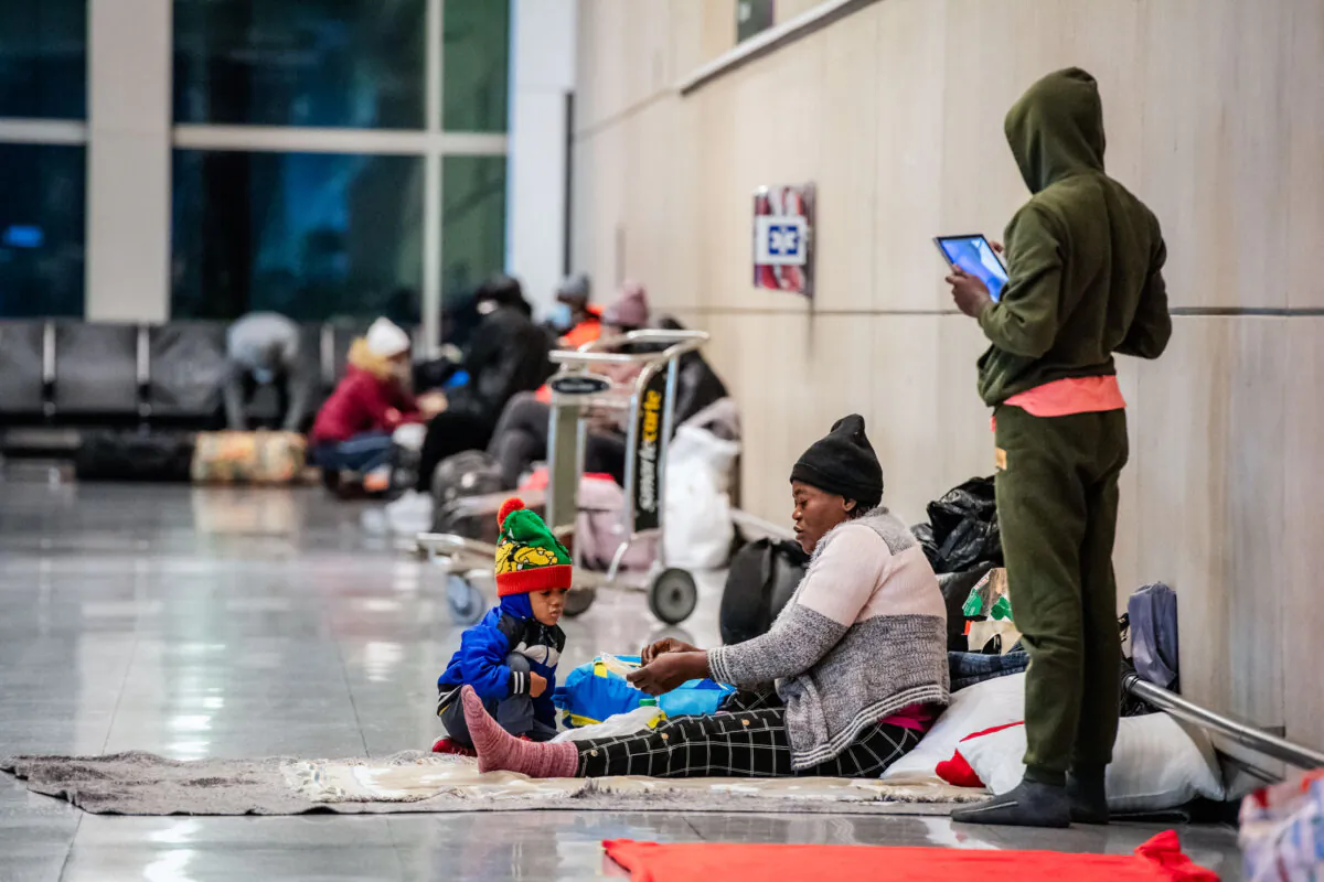 Illegal immigrants use Terminal E at Boston Logan International Airport as a shelter on Jan. 30, 2024. (Joseph Prezioso/AFP via Getty Images)