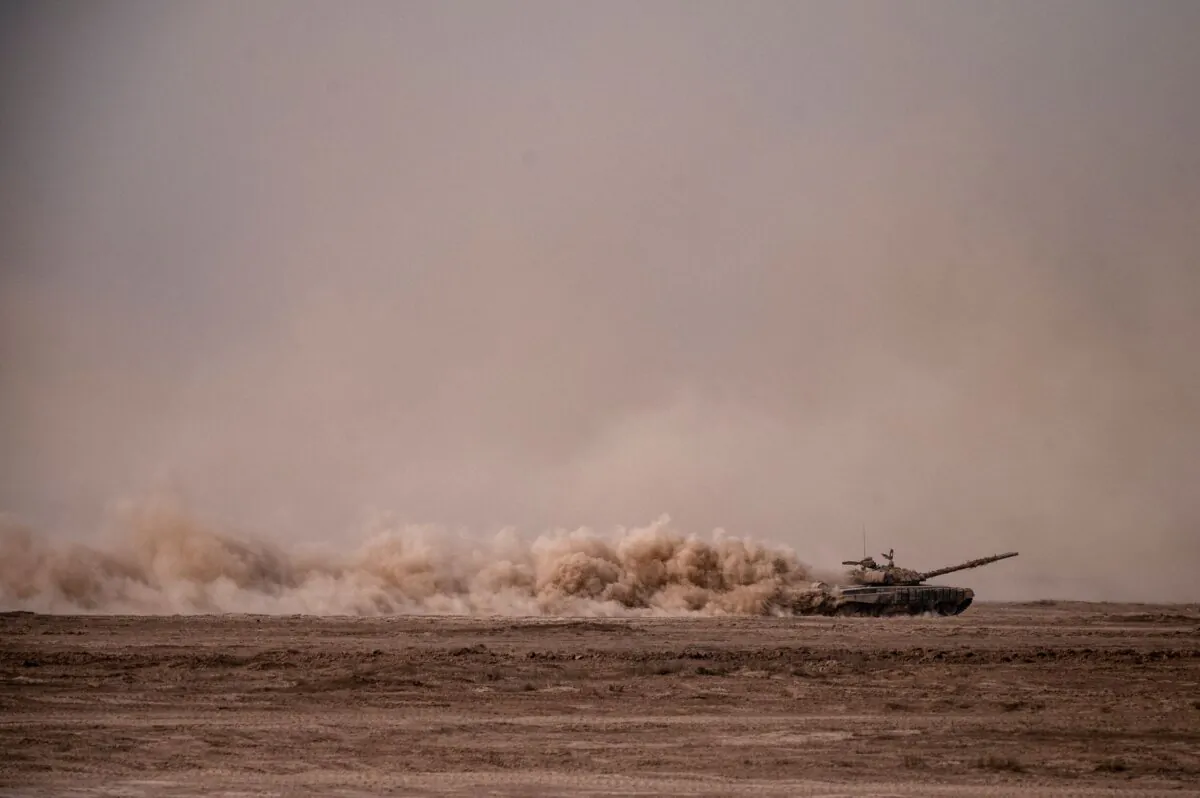 A Russian Army T-72B3 main battle tank moves through the dust during military exercises at the Kapustin Yar range in the Astrakhan region during the "Caucasus-2020" military drills gathering troops from China, Iran, Pakistan, and Burma, along with ex-Soviet Armenia, Azerbaijan, and Belarus, in southern Russia on Sept. 25, 2020. (Dimitar Dilkoff/AFP via Getty Images)