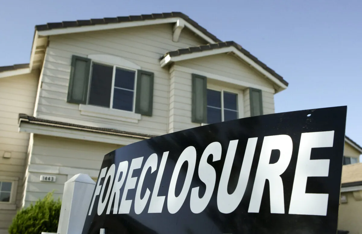 A sign posted in front of a home for sale in Stockton, Calif., on April 29, 2008. (Justin Sullivan/Getty Images)