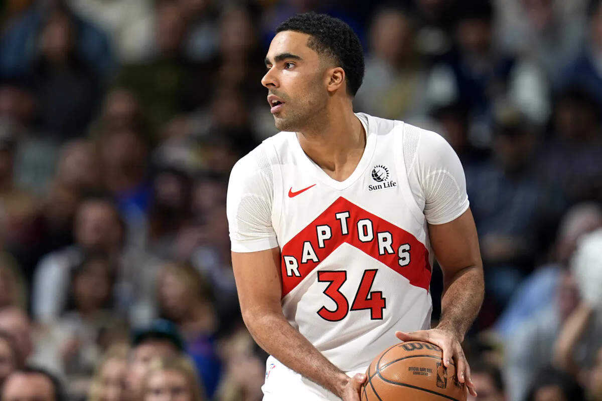 Toronto Raptors center Jontay Porter (34) looks to pass in the first half of an NBA basketball game in Denver on March 11, 2024. (David Zalubowski/AP Photo)