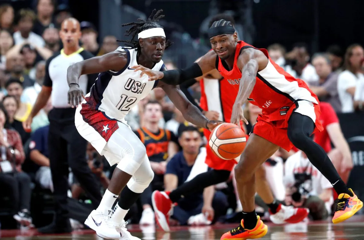 United States guard Jrue Holiday (L) and Canada guard Shai Gilgeous-Alexander vie for the basketball during an exhibition game in Las Vegas on July 10, 2024. (Steve Marcus/AP Photo)