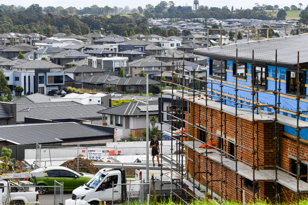 A labourer works on an under construction house in the western Sydney, Australia, on May 4, 2022. (Saeed Khan/AFP via Getty Images)