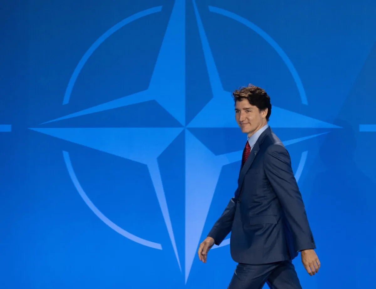 Prime Minister Justin Trudeau walks off the stage following an official welcome at the NATO summit in Washington on July 10, 2024. (The Canadian Press/Adrian Wyld)
