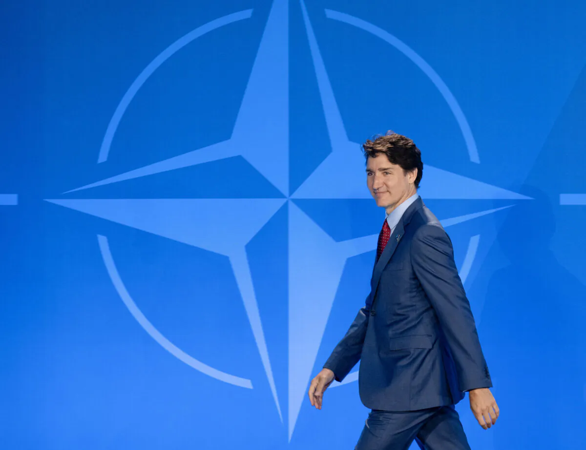 Prime Minister Justin Trudeau walks off the stage following an official welcome at the NATO summit in Washington on July 10, 2024. (The Canadian Press/Adrian Wyld)