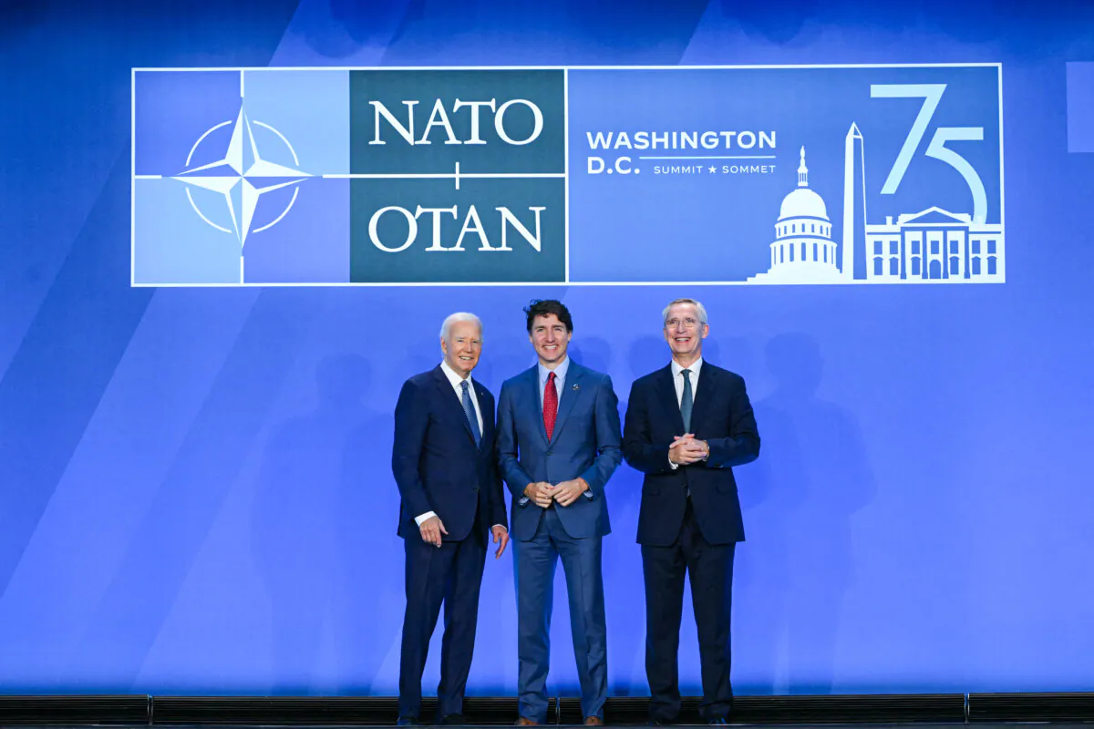 Justin Trudeau, Prime Minister of Canada (C) poses with U.S. President Joe Biden (L) and NATO Secretary General Jens Stoltenberg during the NATO 75th anniversary summit in Washington on July 10, 2024.(MANDEL NGAN/AFP via Getty Images)
