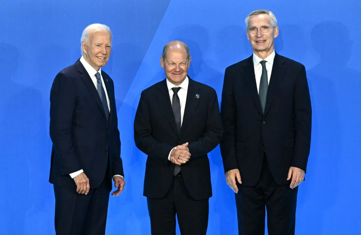 Olaf Scholz, Chancellor of Germany (C) is welcomed by U.S. President Joe Biden (L), and NATO Secretary General Jens Stoltenberg during the NATO 75th anniversary summit at the Walter E. Washington Convention Center in Washington on July 10, 2024. (Brendan Smialowski/AFP via Getty Images)