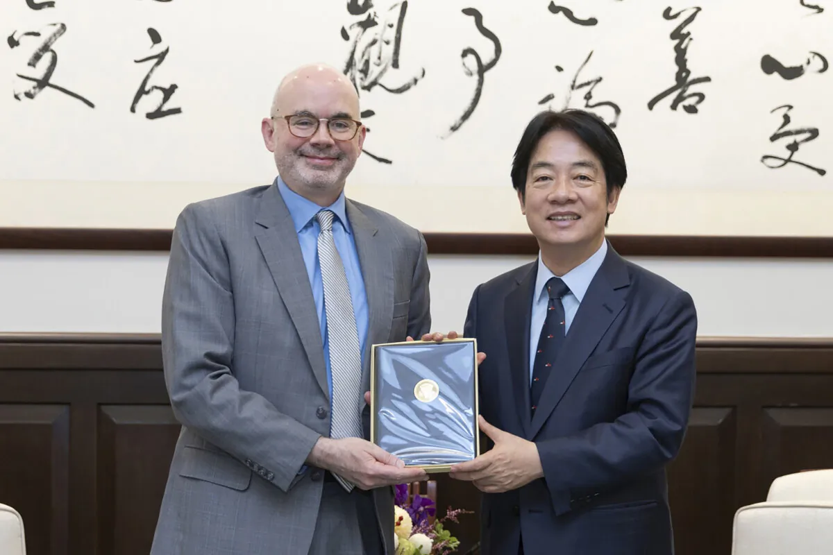 Taiwan's President William Lai Ching-te (R) poses for photos with American Institute in Taiwan (AIT)'s new director, Raymond Greene, in Taipei, Taiwan, on July 10, 2024. (Taiwan Presidential Office via AP)