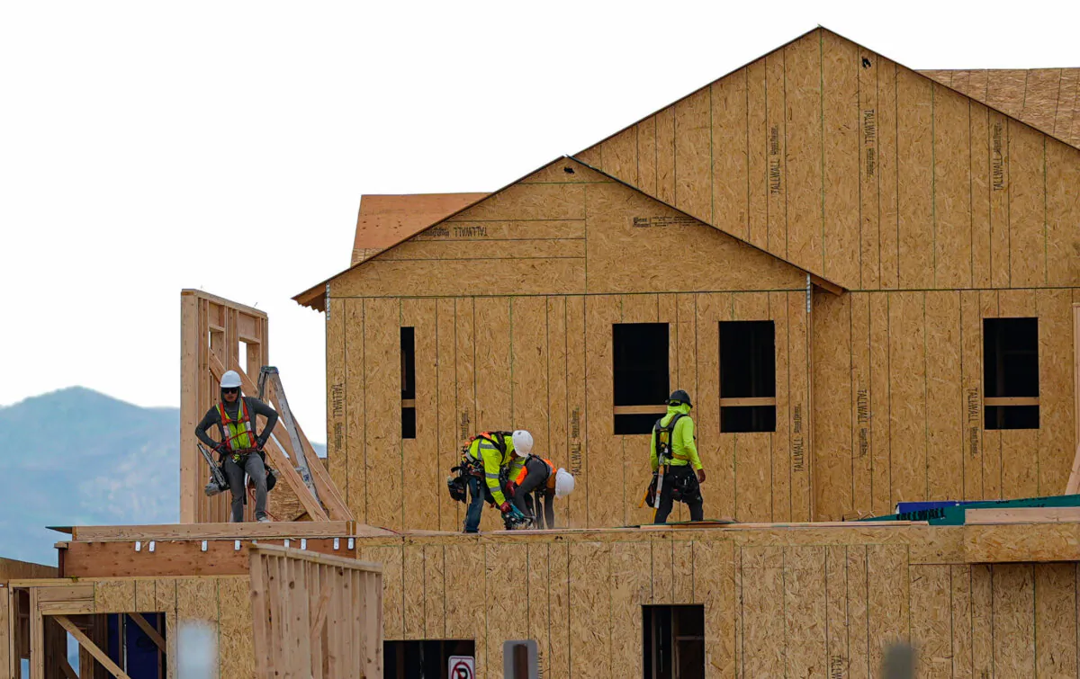 Workers construct new homes in a development in Loveland, Colo., on June 25, 2024. (David Zalubowski/AP Photo)