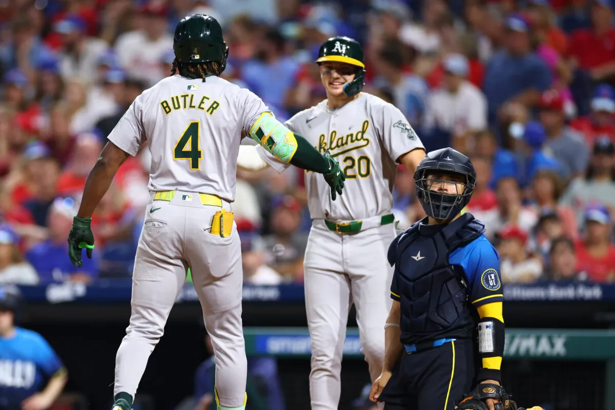 Lawrence Butler (4) of the Oakland Athletics celebrates with Zack Gelof (20) at home plate after a two run home run against the Philadelphia Phillies in the eighth inning in Philadelphia on July 12, 2024. (Heather Barry/Getty Images)