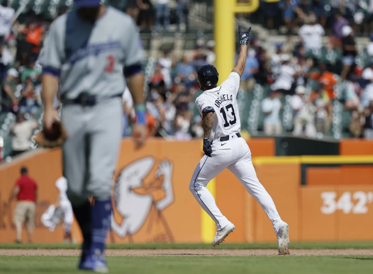 Gio Urshela (13) of the Detroit Tigers rounds the bases after hitting a two-run, walk-off home run to defeat the Los Angeles Dodgers in the 10th inning in Detroit on July 13, 2024. (Duane Burleson/Getty Images)