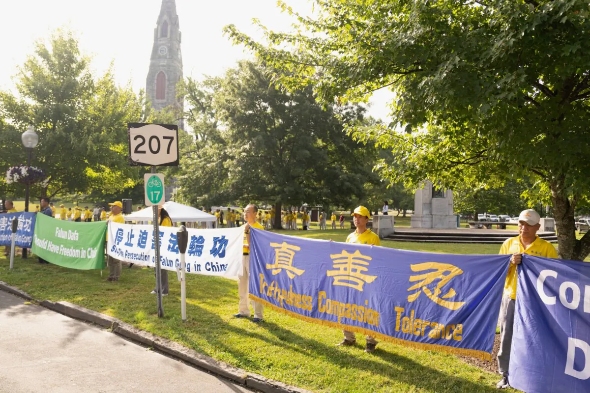 Falun Gong practitioners held a rally to raise awareness of 25-year persecution of the practice by Chinese regime in Goshen, N.Y., on July 13, 2024. (Larry Dye/The Epoch Times)