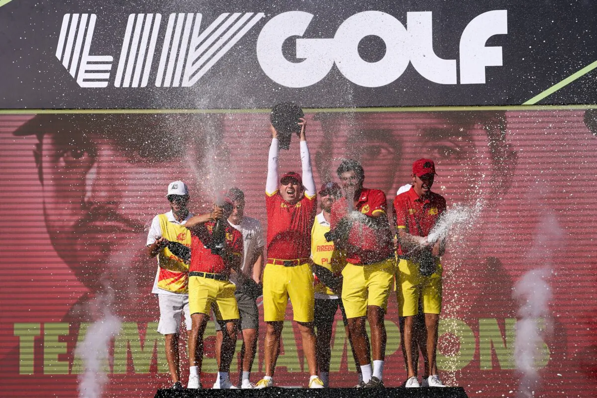Sergio Garcia, Abraham Ancer, Eugenio Chacarra and David Puig of Fireballs GC celebrate with the trophy after winning the team portion of the LIV Golf Andalucia in Sotogrande, Spain, on July 14, 2024. (Angel Martinez/Getty Images)