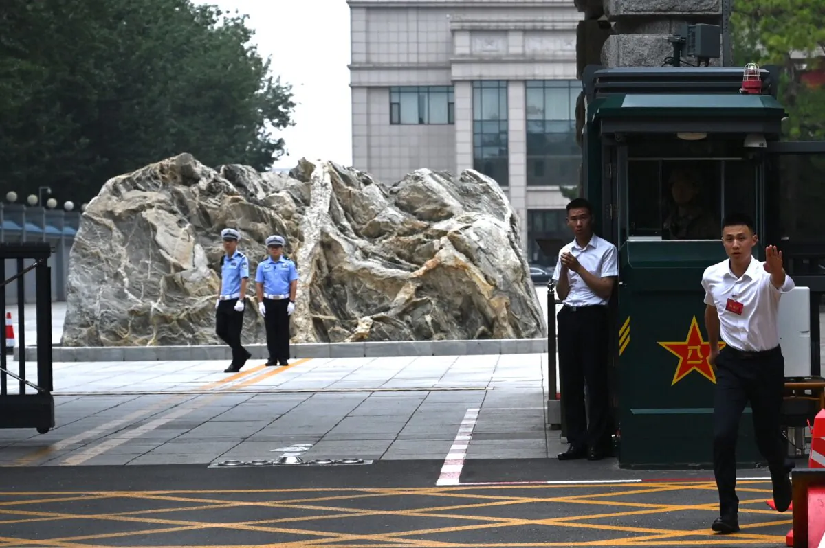 Security guards stand outside the Jingxi Hotel, where Chinese officials are conducting the Third Plenum, a key economic meeting, in Beijing on July 15, 2024. (Greg Baker/AFP via Getty Images)