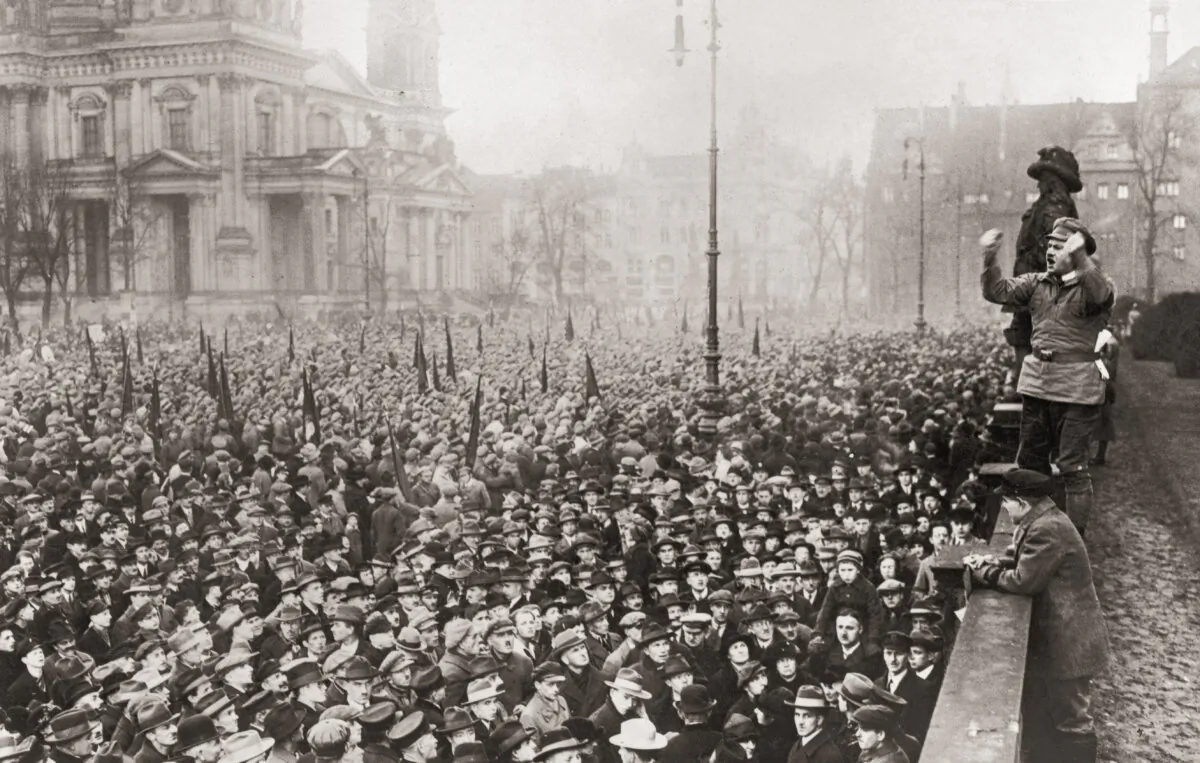 A communist speaker addresses a large crowd in Berlin to protest about the unemployment situation in Germany, circa 1920. (FPG/Hulton Archive/Getty Images)