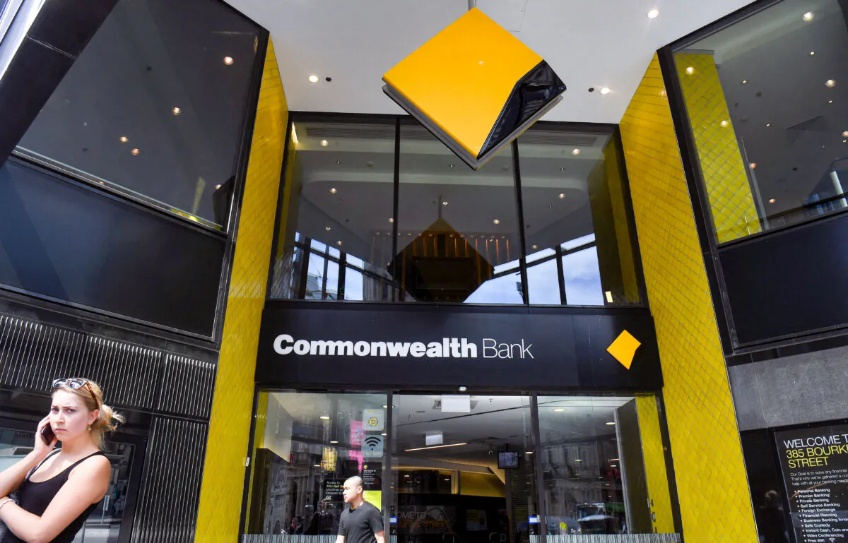 People walk past a branch of the Commonwealth Bank in Melbourne, Australia, on Feb. 6, 2019. (William West/AFP via Getty Images)