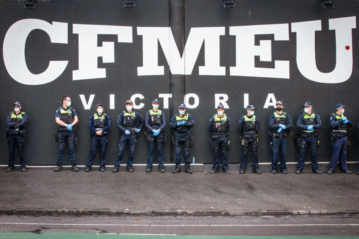 Members of Victoria Police stand outside the CFMEU Office in Melbourne, Australia, on Sept. 21, 2021. (Darrian Traynor/Getty Images)