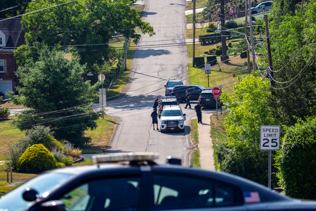 State and local police block off roads surrounding the home of the suspected shooter of former President Donald Trump, as the FBI carries out an investigation, in Bethel Park, Pa., on July 14, 2024. (Rebecca Droke/AFP via Getty Images) Joseph Lord