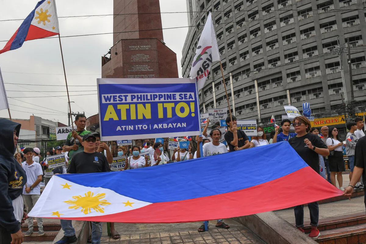 Protesters take part in a rally to mark the anniversary of the 2016 arbitral ruling on the South China Sea, at a park in Manila, Philippines, on July 12, 2024. The Philippines will "stand our ground" in a dispute with Beijing over the South China Sea, a top security official said on that day, eight years after an international ruling against China in the territorial contest. (Ted Aljibe/AFP via Getty Images)