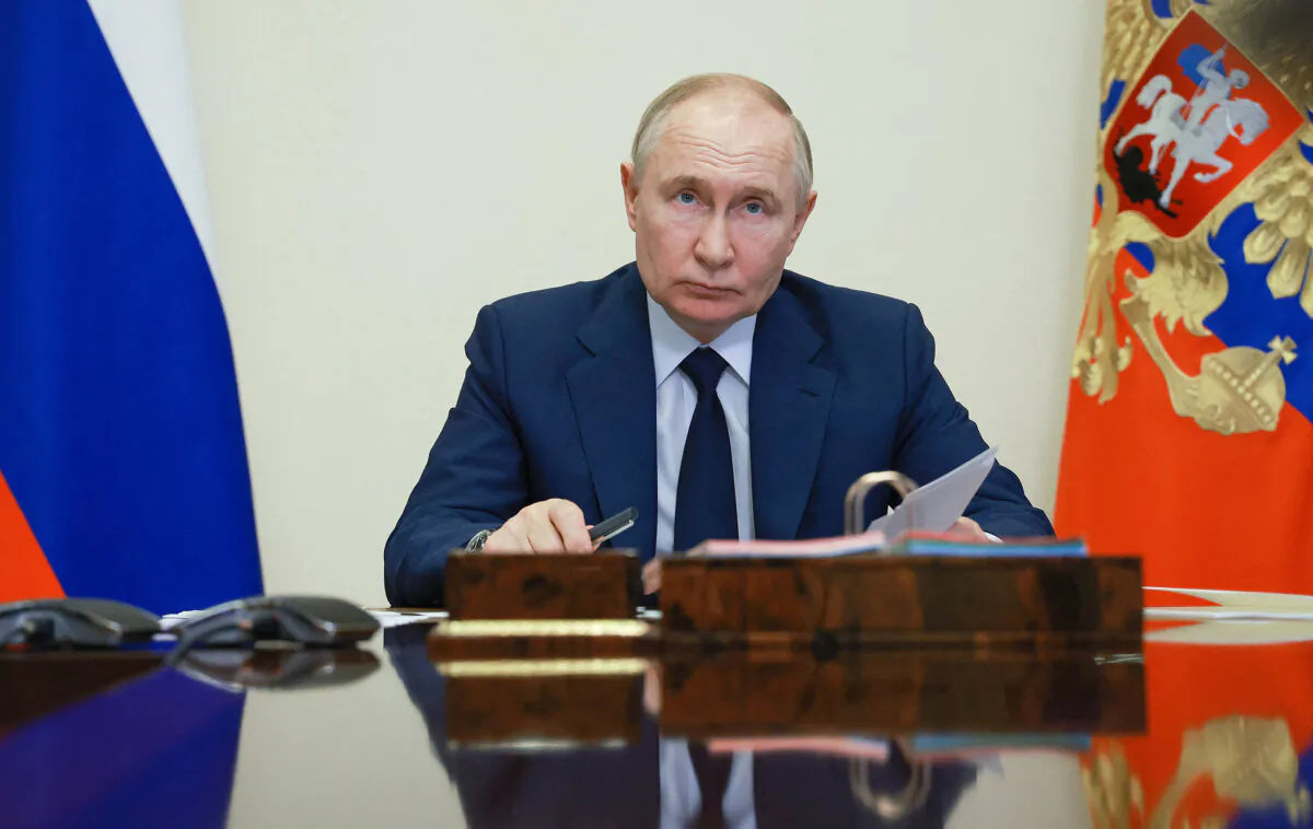 Russian President Vladimir Putin attends a ceremony to launch several new facilities of the metallurgical industry in Russia's regions via videoconference at the Novo-Ogaryovo state residence, outside Moscow, on July 15, 2024. (Vyacheslav Prokofyev/Pool/AFP via Getty Images)