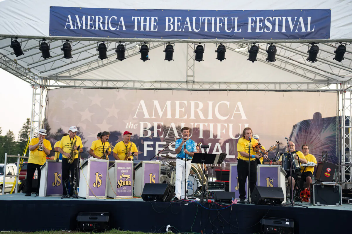 Award-winning polka singer Jimmy Sturr (C) performs with his band at the America the Beautiful Festival in the Town of Deerpark, N.Y., on July 13, 2024. (Larry Dye/The Epoch Times)