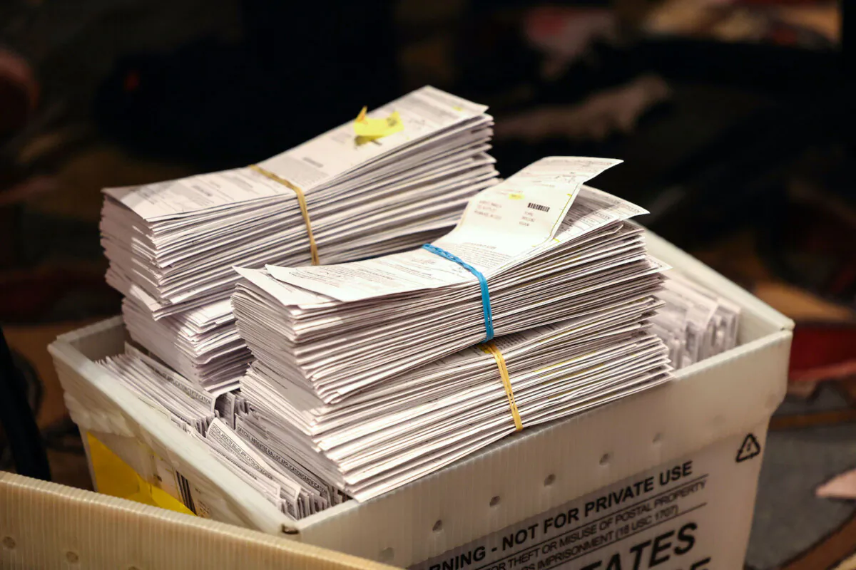 Election ballots are shown as workers count mail-in and in-person absentee ballots at the Wisconsin Center in Milwaukee on Nov. 8, 2022. (Scott Olson/Getty Images)