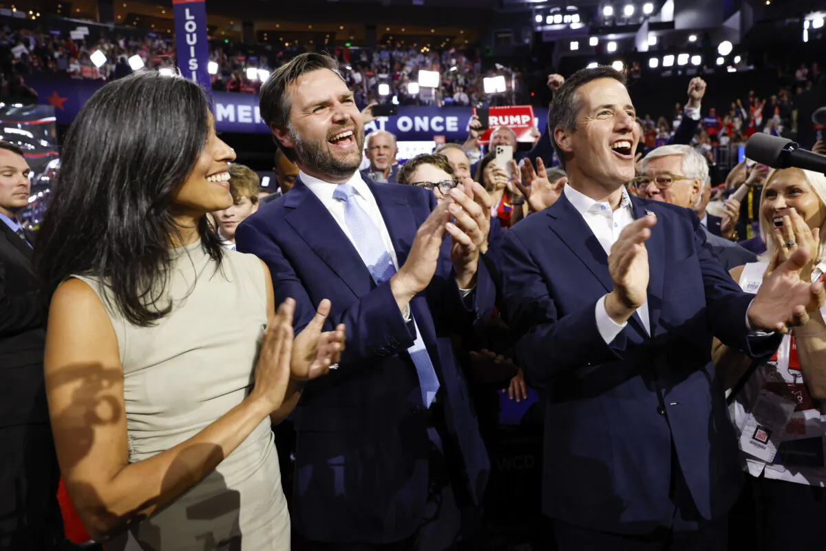 Sen. J.D. Vance (R-Ohio) celebrates his nomination for the office of Vice President alongside his wife, Usha Chilukuri Vance, and Ohio Delegate Bernie Moreno on the first day of the Republican National Convention at the Fiserv Forum in Milwaukee on July 15, 2024. (Anna Moneymaker/Getty Images)