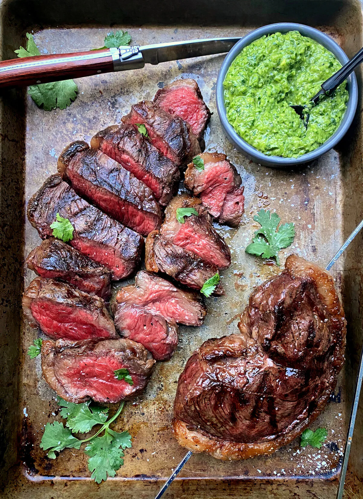 An herbaceous green sauce perfectly complements the rich, flavorful meat. (Lynda Balslev for Tastefood)