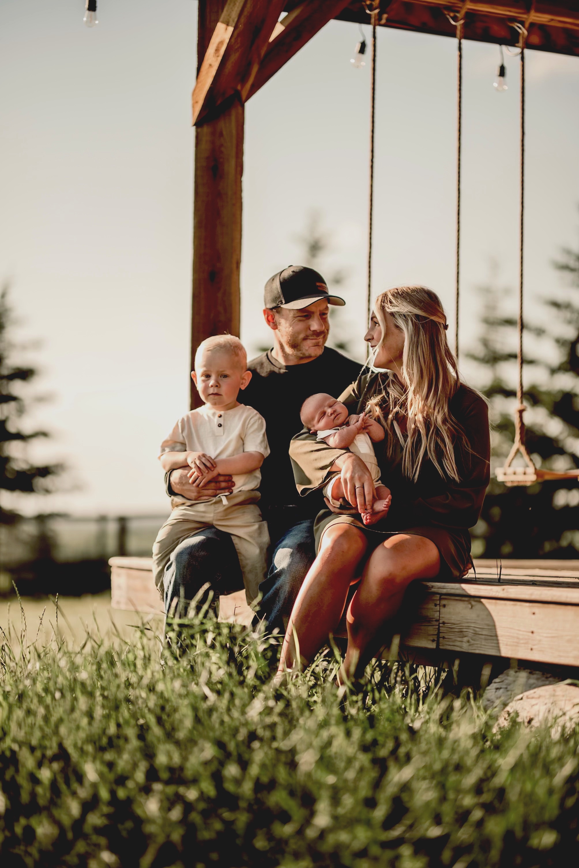 Mr. and Ms. Gregory with their toddler and newborn son.