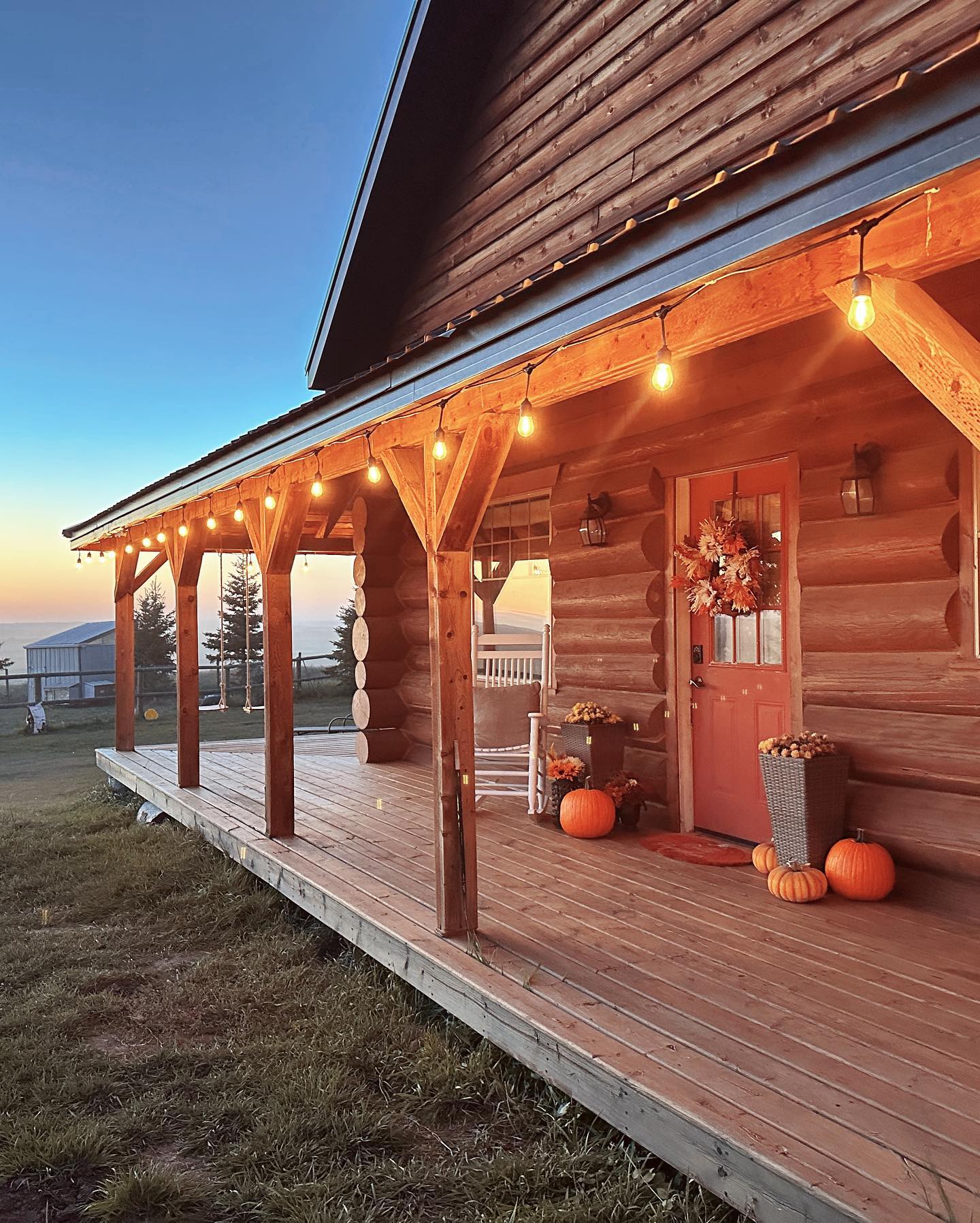 The log cabin overlooks the mountains in rural Alberta.
