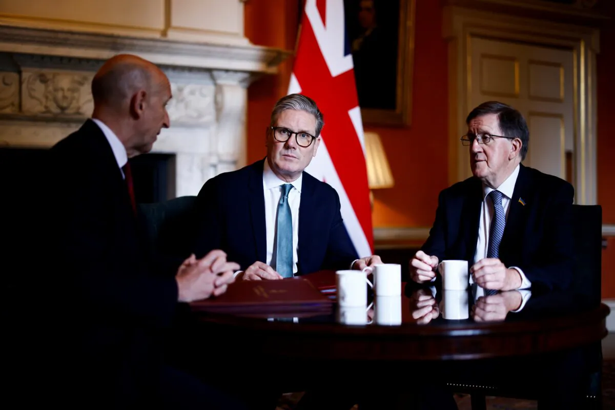 Prime Minister Sir Keir Starmer (C) meets with Defence Secretary John Healey (L) and former NATO chief Lord Robertson of Port Ellen (R) to discuss the root-and-branch defence review, at 10 Downing Street in London, on July 16, 2024. (Benjamin Cremel/PA Wire)