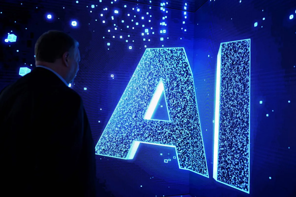 A visitor watches an artificial intelligence sign on an animated screen in Barcelona, Spain, on Feb. 28, 2023. (Josep Lago/AFP via Getty Images)