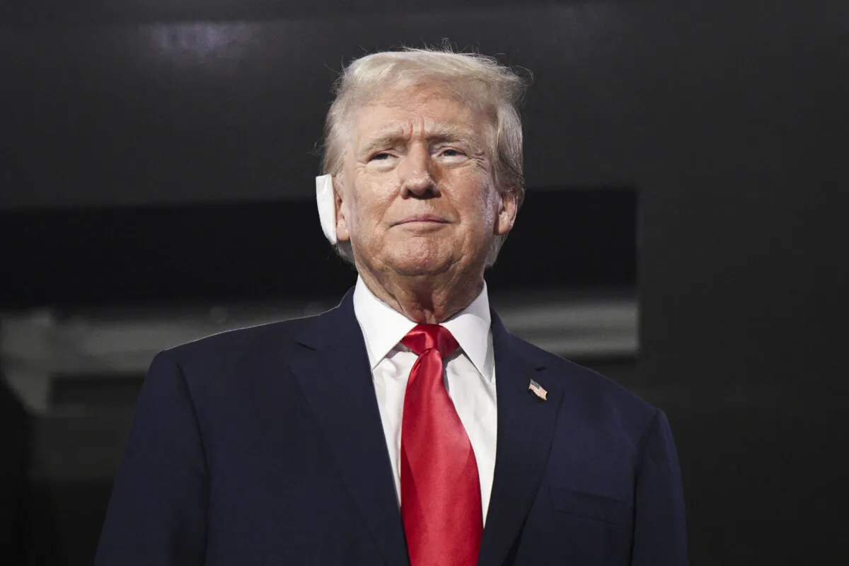 Former President and 2024 Republican presidential candidate Donald Trump, a bandage on his ear after being wounded in an assassination attempt, attends the first day of the 2024 Republican National Convention at the Fiserv Forum in Milwaukee, Wis., on July 15, 2024. (Brendan Smialowski/AFP via Getty Images)