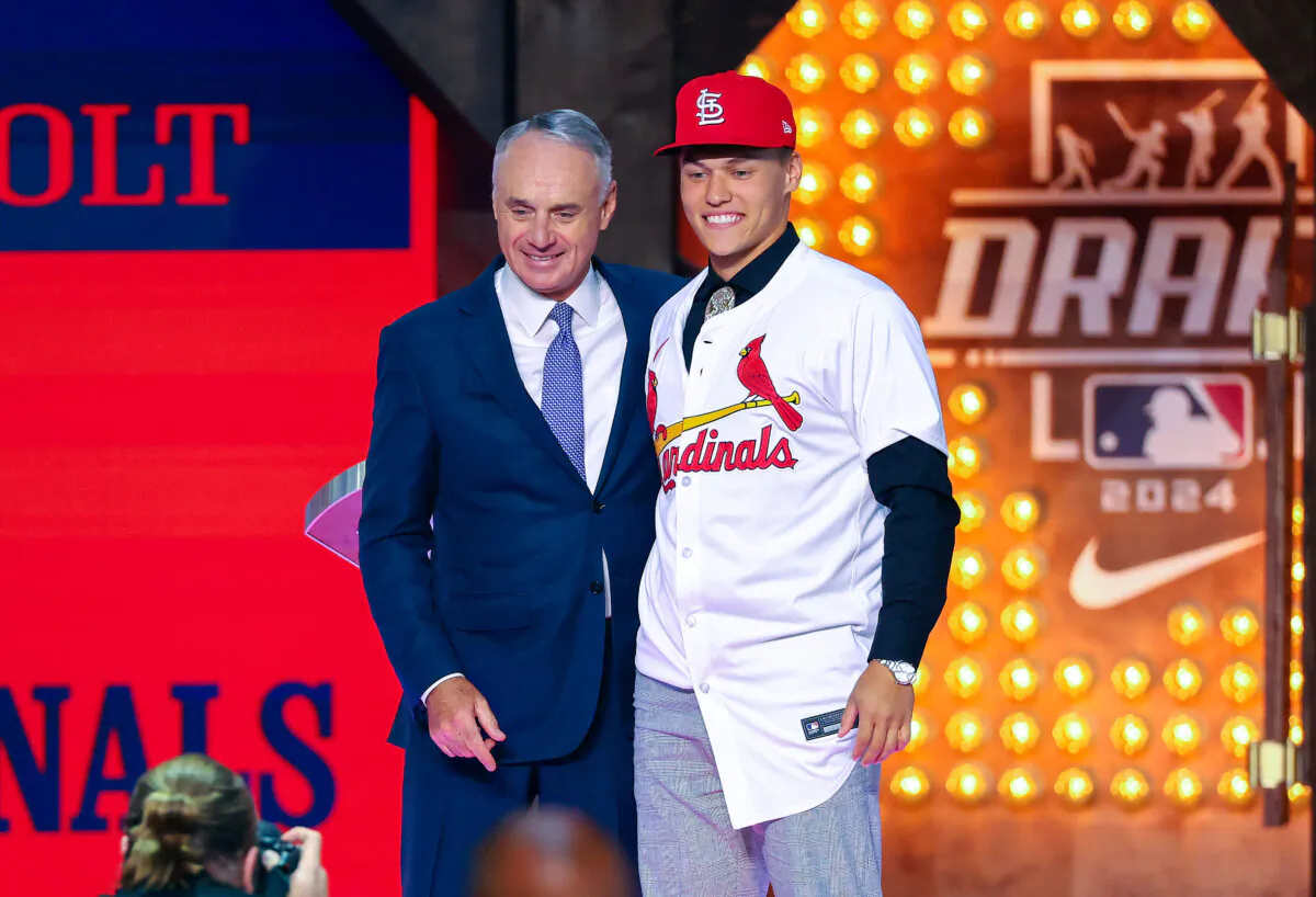 Major League Baseball commissioner Robert D. Manfred Jr. congratulates JJ Wetherholt, selected by the St. Louis Cardinals in the first round of the 2024 MLB Draft at Cowtown Coliseum in Fort Worth, Texas., on July 14, 2024. (Richard Rodriguez/Getty Images)