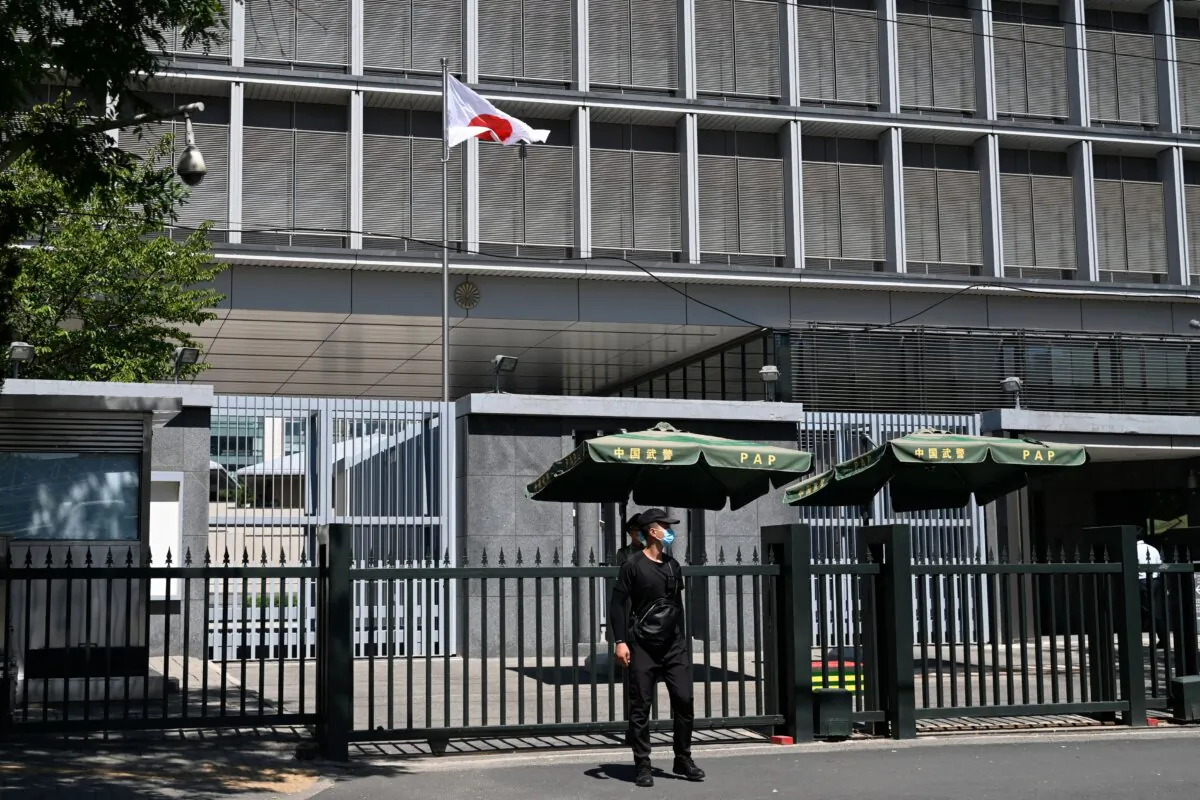 Police and security personnel stand outside the entrance of the Japanese embassy in Beijing on Aug. 29, 2023. (Pedro Pardo/AFP via Getty Images)