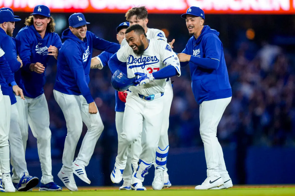 Teoscar Hernandez is congratulated by fellow members of the Los Angeles Dodgers after his ninth-inning, game-winning hit against the Arizona Diamondbacks in Los Angeles on July 2, 2024. (Ryan Sun/AP Photo)