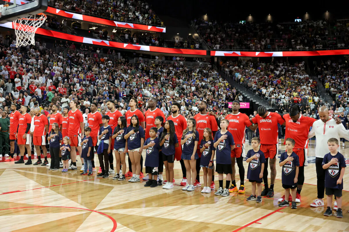 Players from Canada line up on the court for the playing of national anthems before an exhibition game against the United States ahead of the Paris Olympic Games at T-Mobile Arena in Las Vegas, Nevada., on July 10, 2024. (Ethan Miller/Getty Images)