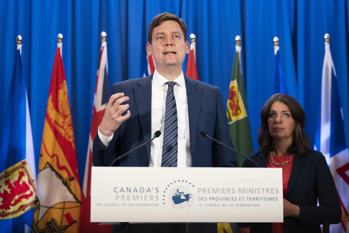 British Columbia Premier David Eby (L) speaks to reporters with Alberta Premier Danielle Smith during meetings with Canada's other premiers at the Council of the Federation in Halifax on July 16, 2024. (The Canadian Press/Darren Calabrese)