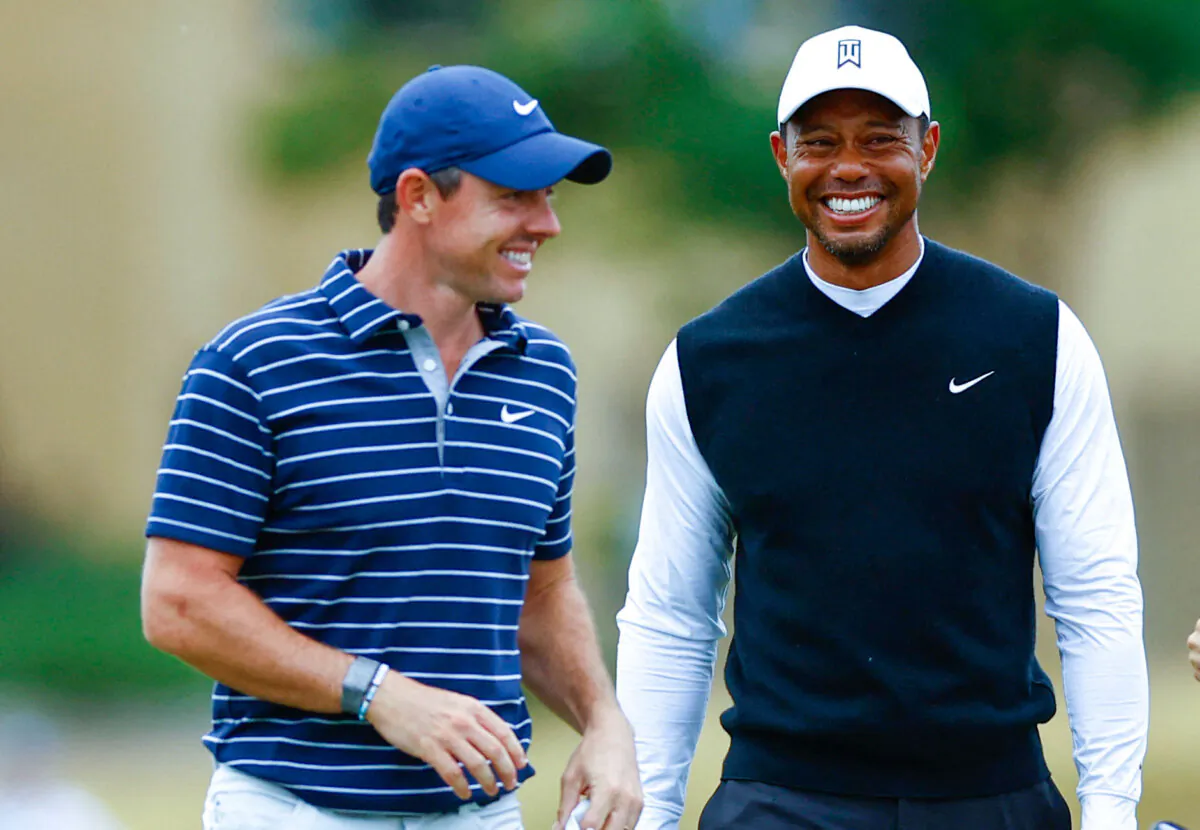 Tiger Woods of the U.S. and Northern Ireland's Rory McIlroy of Team Woods during the Celebration of Champions four hole tournament during the Golf - 150th Open Championship in St. Andrews, Scotland, Britain, on July 11, 2022. (Andrew Boyers/Reuters)