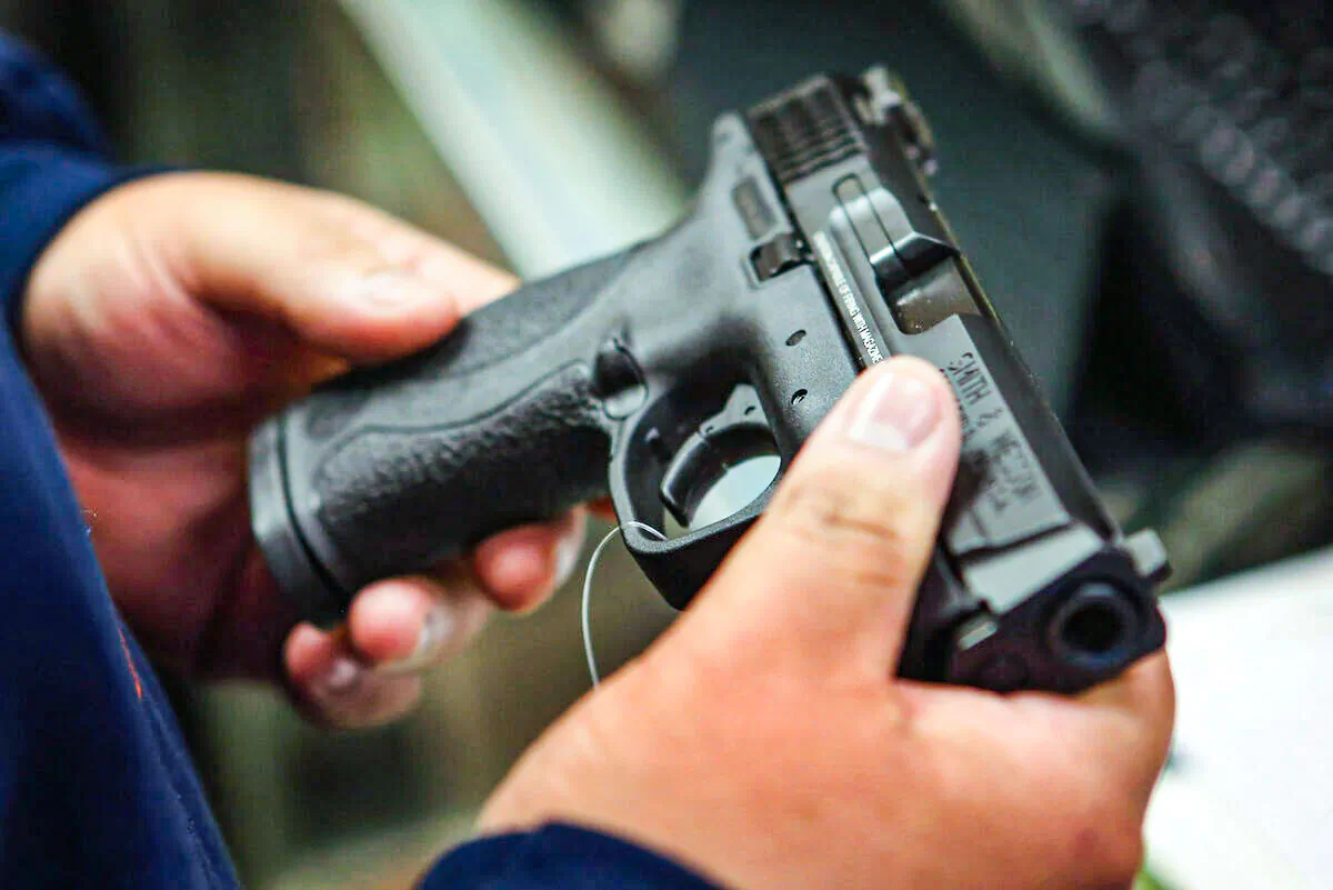 A person holds a gun in an undated file photograph. (Scott Olson/Getty Images)