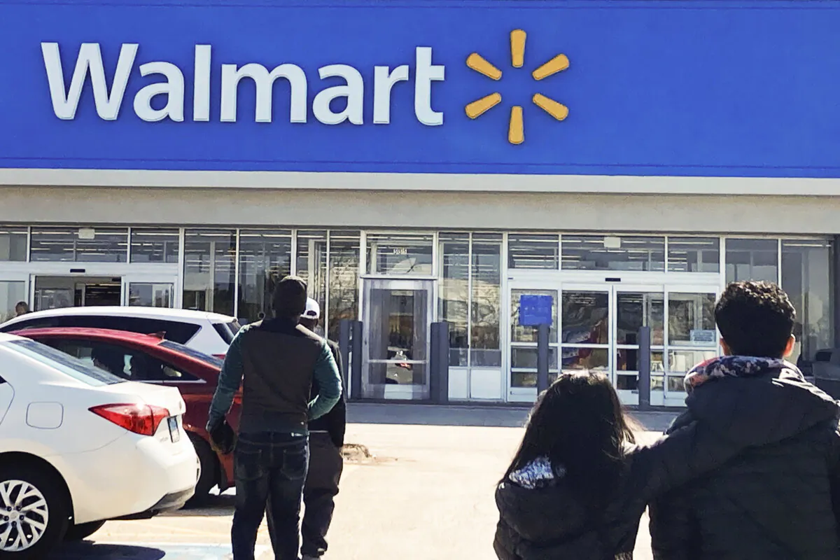 Shoppers walk to a Walmart store in Vernon Hills, Ill., on March 28, 2023. (Nam Y. Huh/AP Photo)