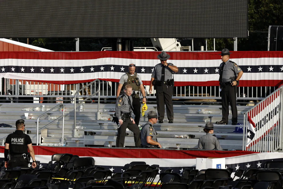 Law enforcement agents stand near the stage of a campaign rally for Republican presidential candidate former President Donald Trump in Butler, Pa., on July 13, 2024. (Anna Moneymaker/Getty Images)