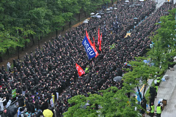 Members of the National Samsung Electronics Union stage a rally as they begin a three-day general strike over pay and benefits outside the company's foundry and semiconductor factory in Hwaseong, South Korea, on July 8, 2024. ( Jung Yeon-Je /AFP via Getty Images)