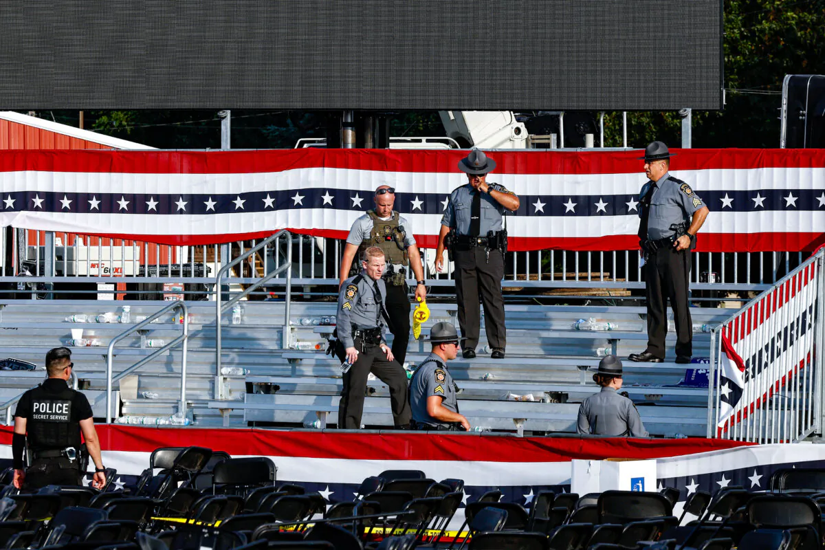 Law enforcement agents stand near the stage of a campaign rally for Republican presidential candidate former President Donald Trump in Butler, Pa., on July 13, 2024. (Anna Moneymaker/Getty Images)