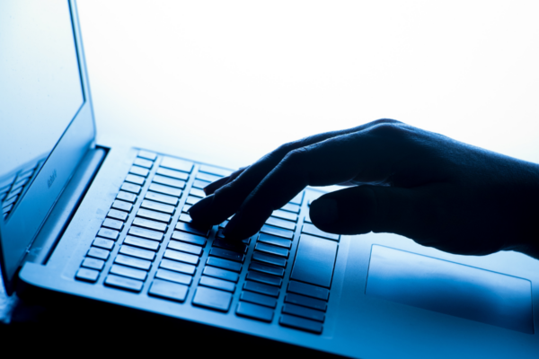 File photo dated March 4, 2017, a woman's hand pressing keys of a laptop keyboard. (Dominic Lipinski/PA Wire)
