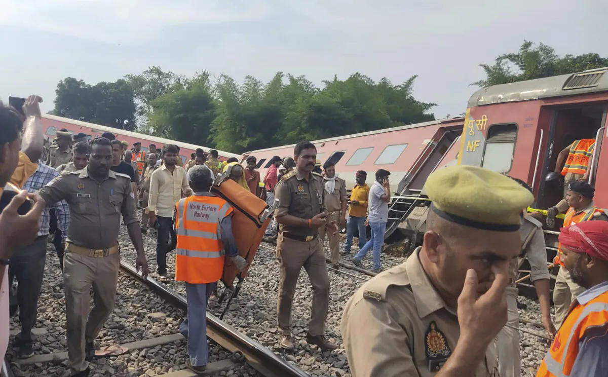 Police and rescuers arrive at the site of a passenger train accident near Gonda, 200 kilometers (125 miles) from Lucknow, India, Thursday, July 18, 2024. (AP Photo)