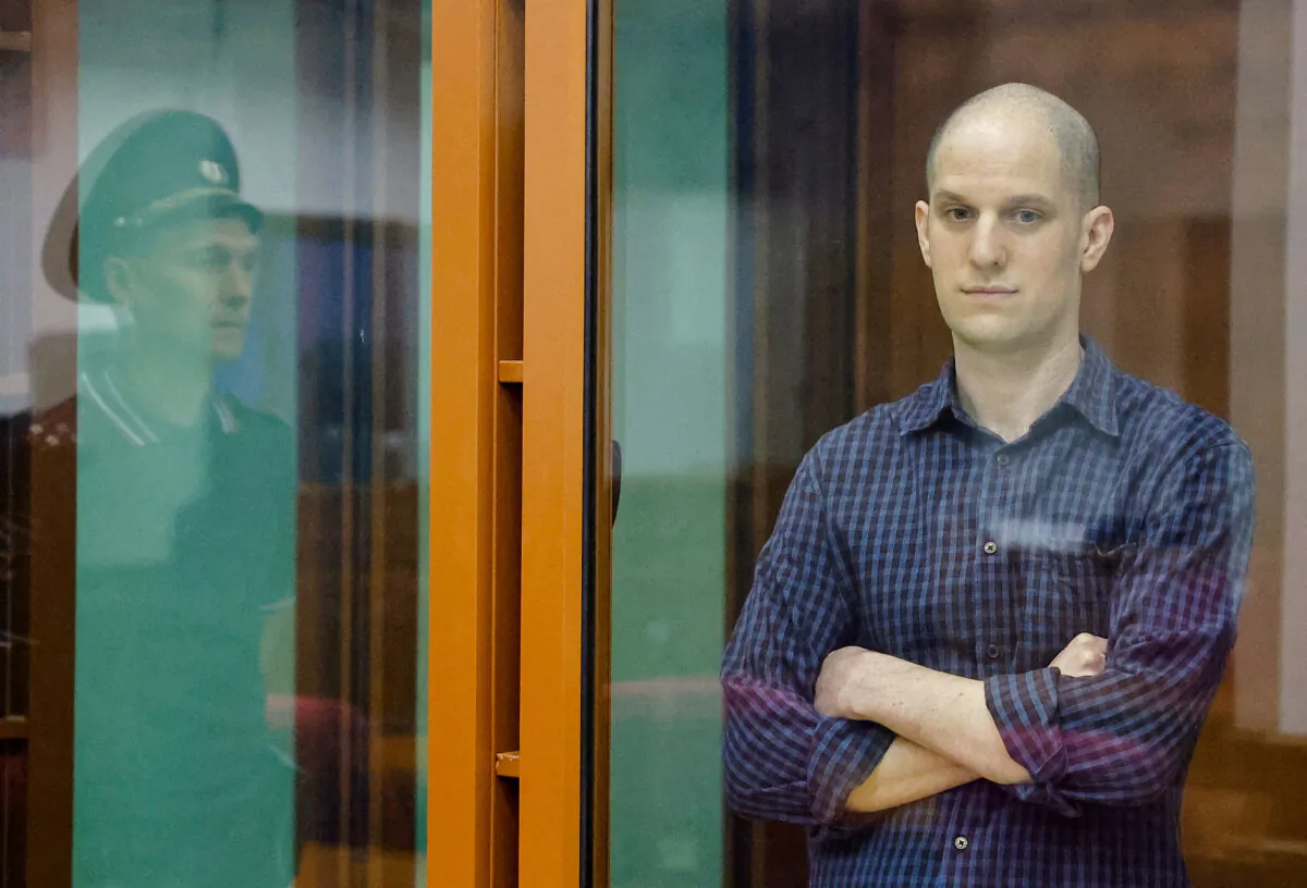 Wall Street Journal reporter Evan Gershkovich inside an enclosure for defendants before a court hearing in Yekaterinburg, Russia, on June 26, 2024. (Evgenia Novozhenina/Reuters)